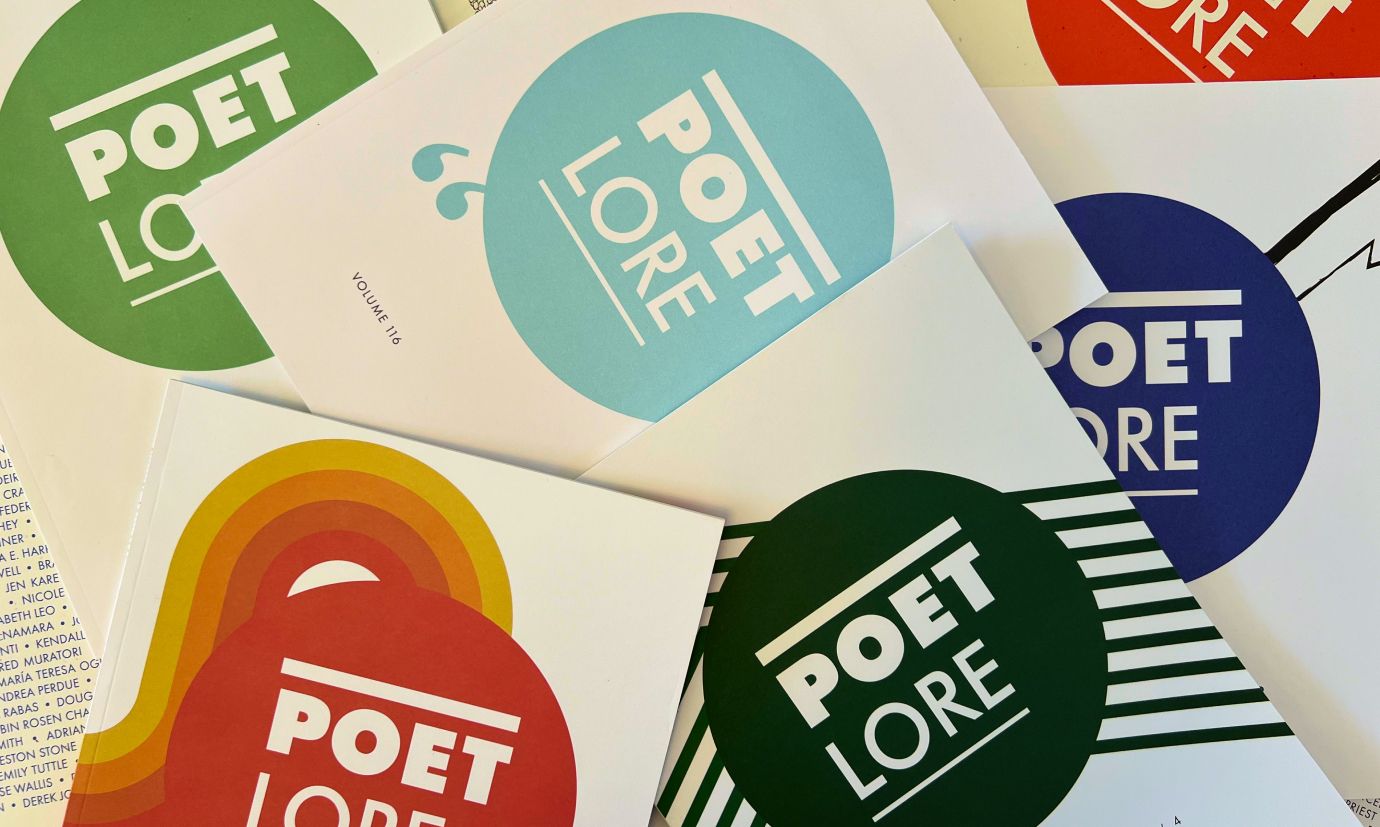 Six issues of Poet Lore lying atop each other. The covers have a circle presented in an array of colors with Poet Lore in the center.