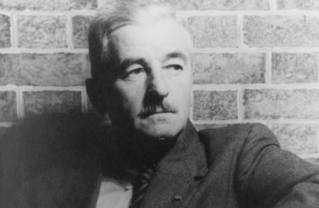 Black and white headshot of author William Faulkner.