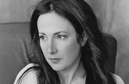 Black and white headshot of poet Kathryn Maris looking to the side.