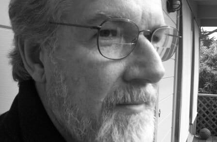 Close-up black and white photograph of poet Paul Hoover