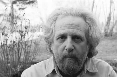 Black and white headshot of poet Baron Wormser outside.