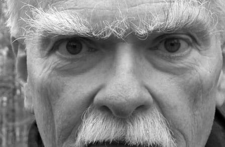 Black and white headshot of poet Robert Kelly.