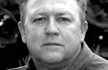 Black and white headshot of writer Greg Sellers
