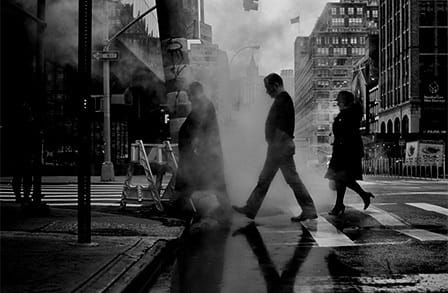Black and white image of New Yorkers crossing the street.