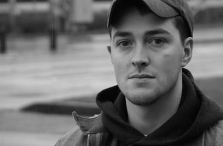 Black and white close-up portrait of poet Lucas Howell