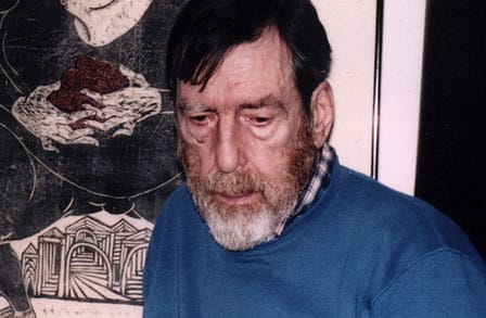 Headshot of poet Russell Edson in a blue sweater.