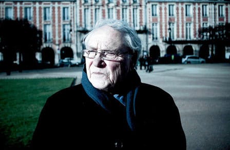 French poet and jazz critic Jacques Reda looking away from the camera.