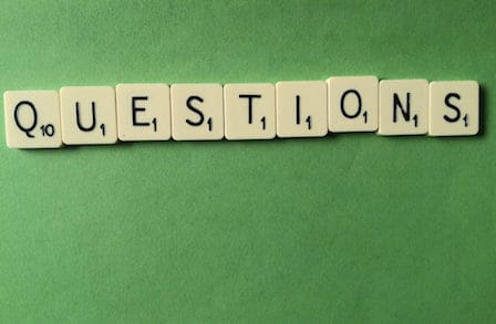 Image of scrabble tiles spelling 'QUESTIONS.'