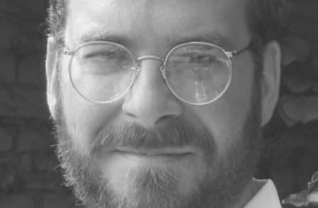 Black and white headshot of poet David Yezzi