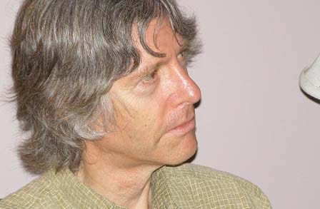 Color photograph of poet Andrew Joron looking to the side