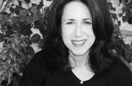Black and white headshot of writer Patty Seyburn outside.