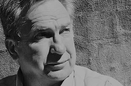 Black and white headshot of poet John Tranter.