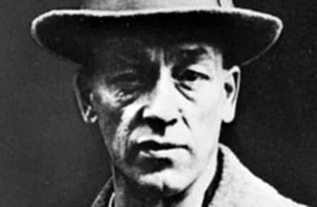 Black and white image of James Stephens in a hat.