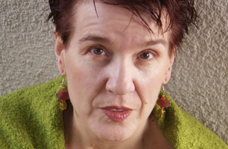 Close-up color photograph of poet, novelist, editor and activist Terry Wolverton