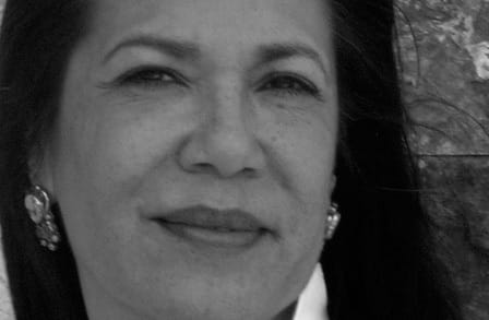 Black and white photograph of the poet, essayist, editor, activist, novelist, and translator Ana Castillo