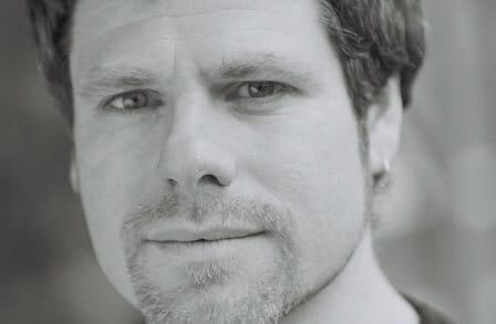 Black and white headshot of poet Joshua Weiner.
