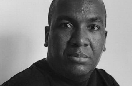 Black and white headshot of writer Reginald Shepherd.