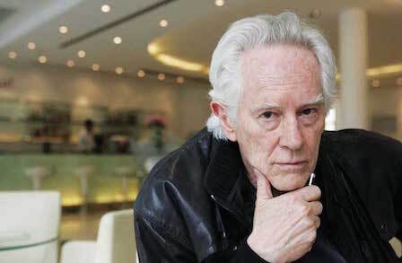 Image of Michael McClure with a hand on his chin.