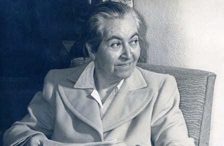 Black and white headshot of poet Gabriela Mistral.