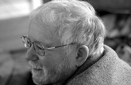 Black and white headshot of poet John Matthias.