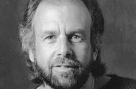 Black and white headshot of poet Michael Waters.