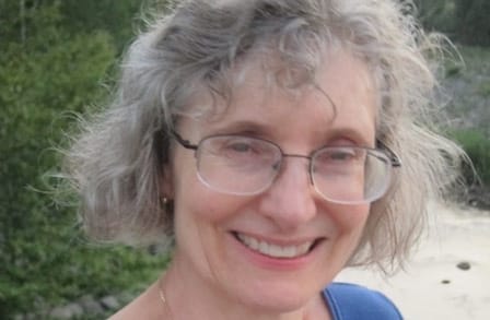 Headshot of poet Rosanna Warren outdoors.