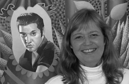 Black and white headshot of poet Hailey Leithauser in front of a painting.