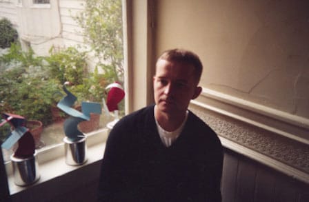 Aaron Baker sitting by a window.