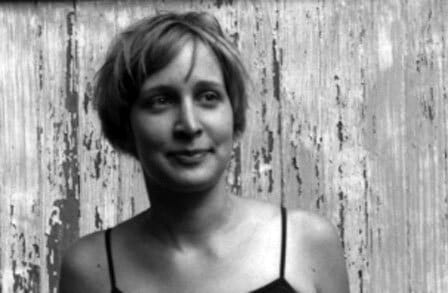 Black and white headshot of poet Emily Rosko.