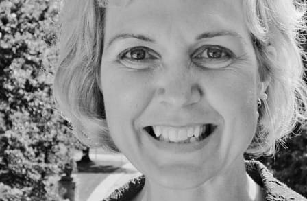 Black and white headshot of poet Joanie Mackowski