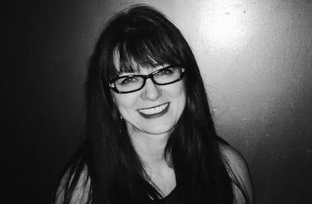 Black and white headshot of poet Simone Muench.