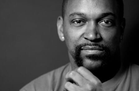 Black and white photograph of spoken-word artist Roger Bonair-Agard
