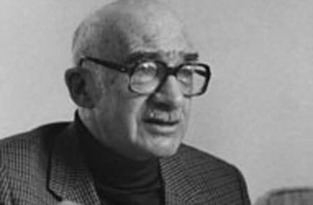 Black and white headshot of writer Abraham Sutkever in a turtleneck and blazer.