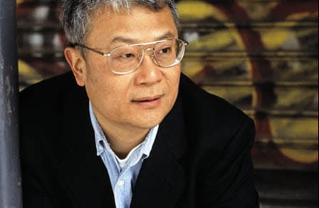 Headshot of poet Ha Jin in a black suit.