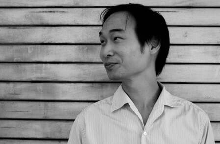 Black and white photograph of poet and media scholar Tung-Hui Hu