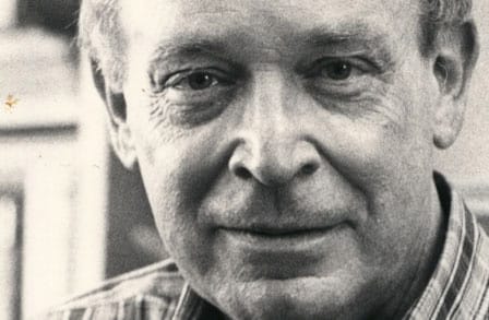 Tight-cropped black and white portrait of William Dickey, looking directly into the camera.
