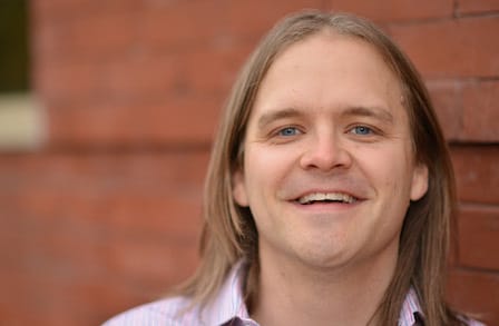 Color photograph poet Gary Dop smiling