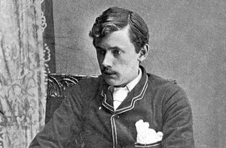 Black and white portrait of Ernest Dowson, looking down.