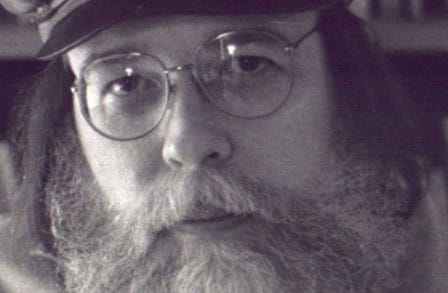 Black and white headshot of poet Norman Dubie.