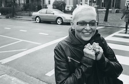 Black and white headshot of writer Jan Beatty in front of a crosswalk.