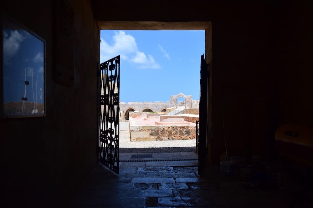 Photo of doors opening to a bright exerior courtyard.