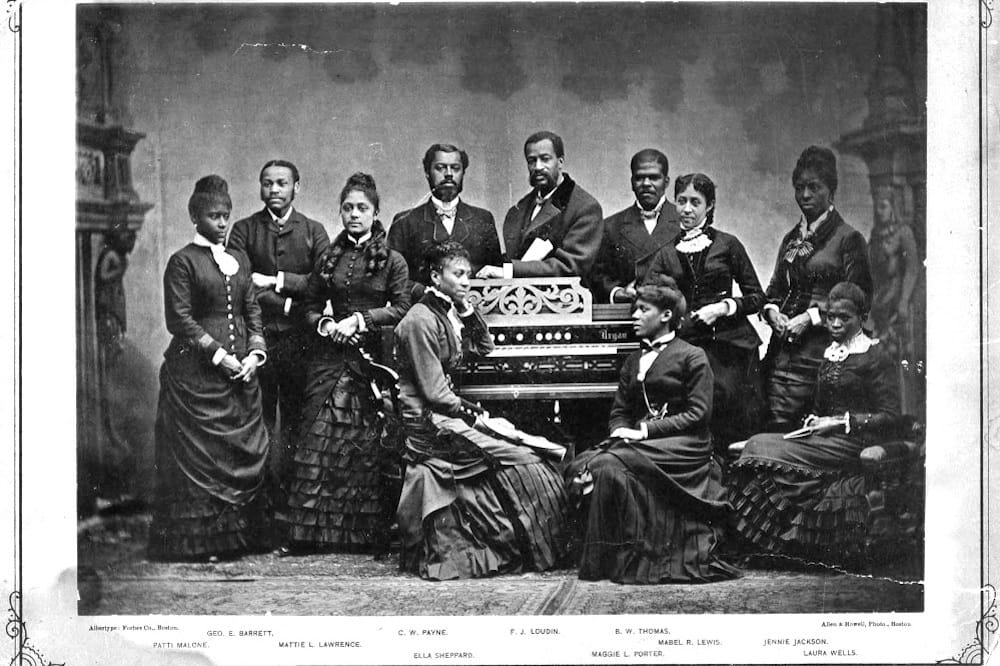 The Fisk Jubilee Singers in 1882. From left to right, Patti Malone, George E. Barrett, Mattie L. Lawrence, C.W. Payne, Ella Shepard (seated), F.J. Loudin, Maggie L. Porter (seated), B.W. Thomas, and Mabel R. Lewis (seated).