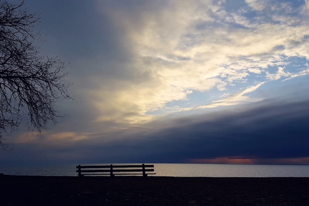 Duriel Harris_park bench by the lake at sunset
