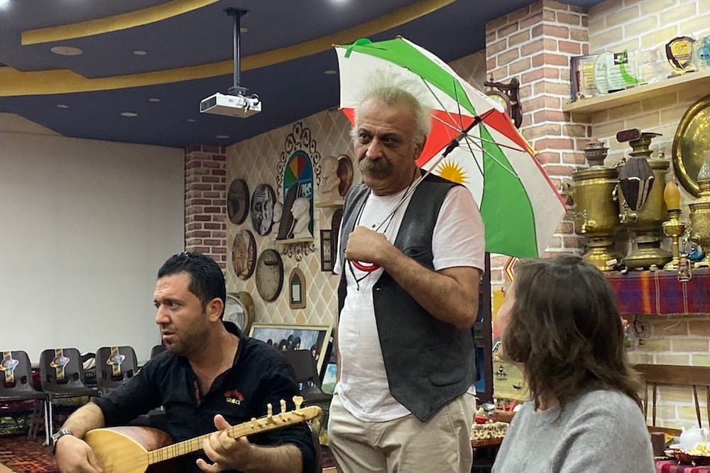 Farhad Pirbal holding umbrella.