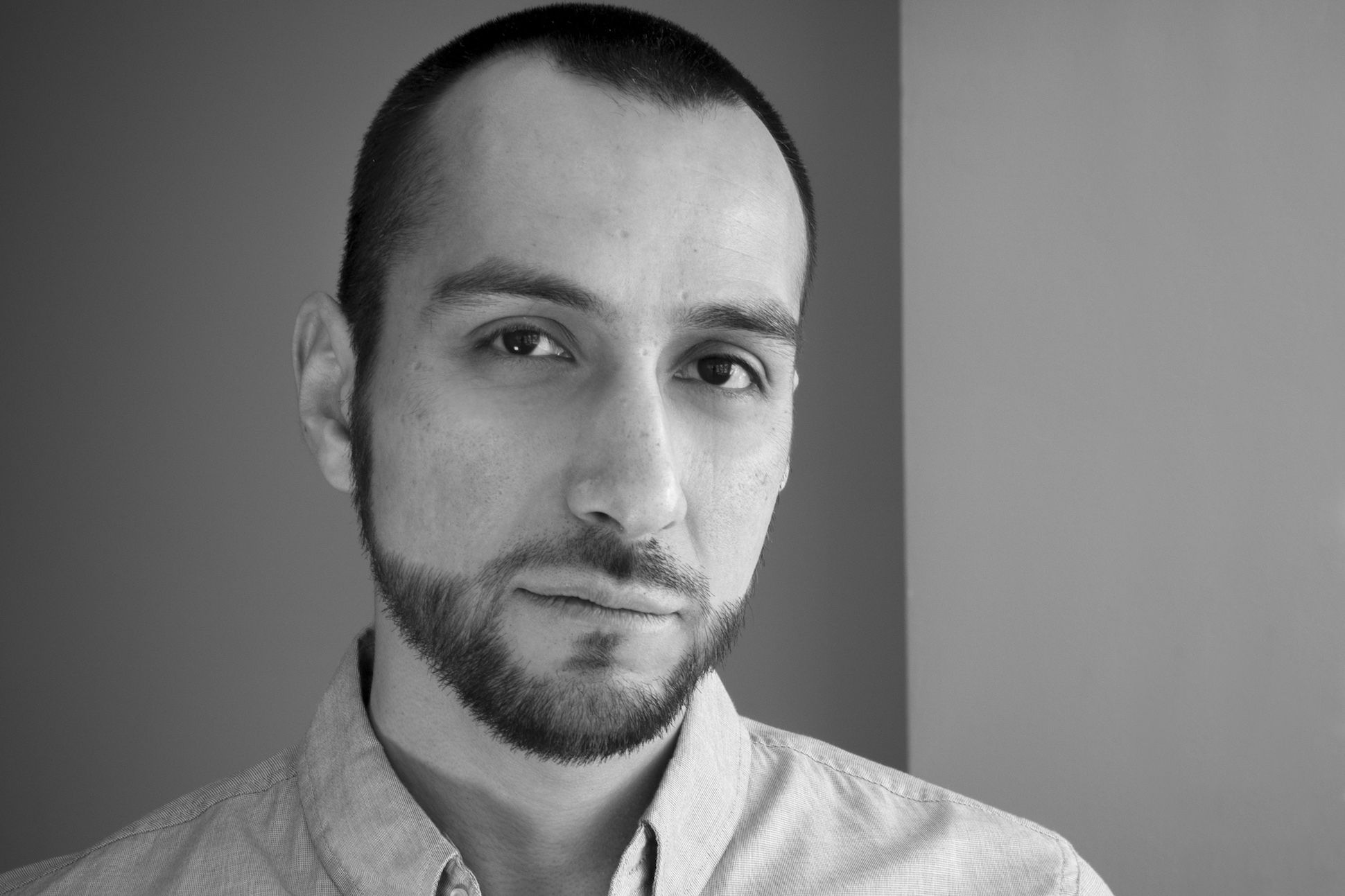 Black and white image of the poet Jacob Saenz.