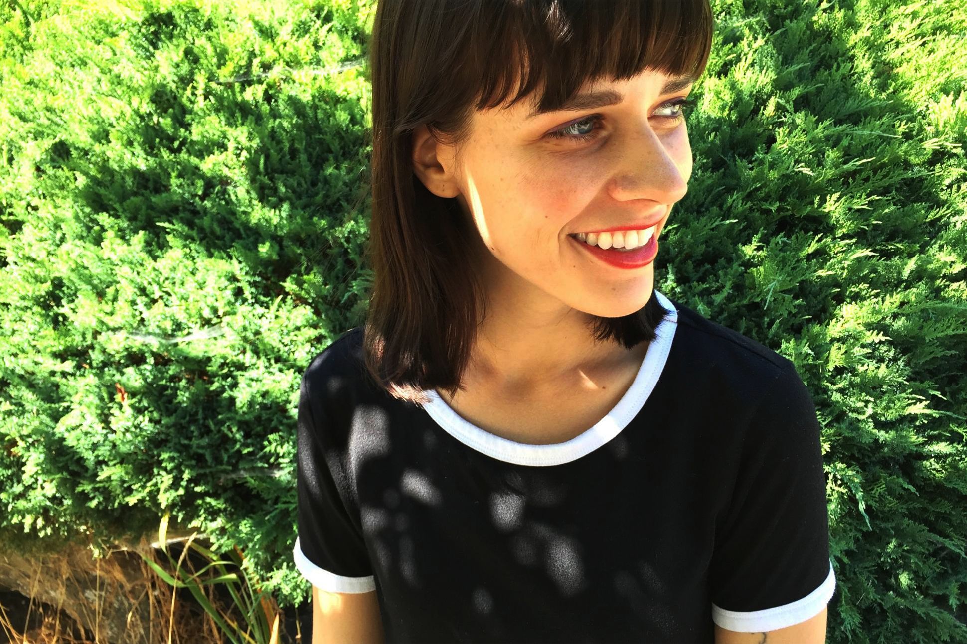 Portrait of Paige Lewis outdoors in the sunlight.