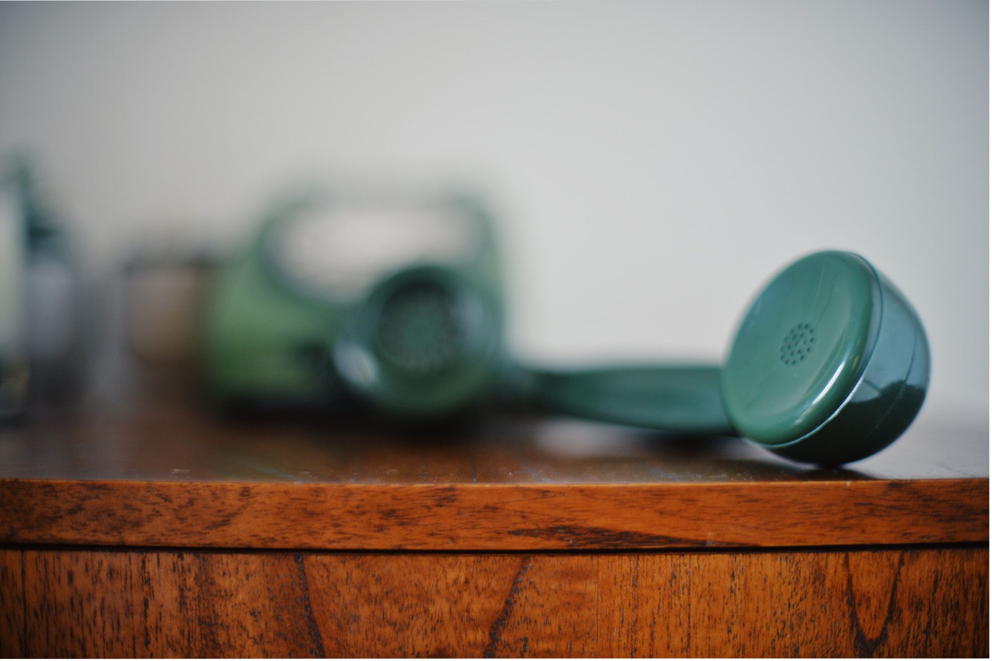 image of old green telephone handset receiver