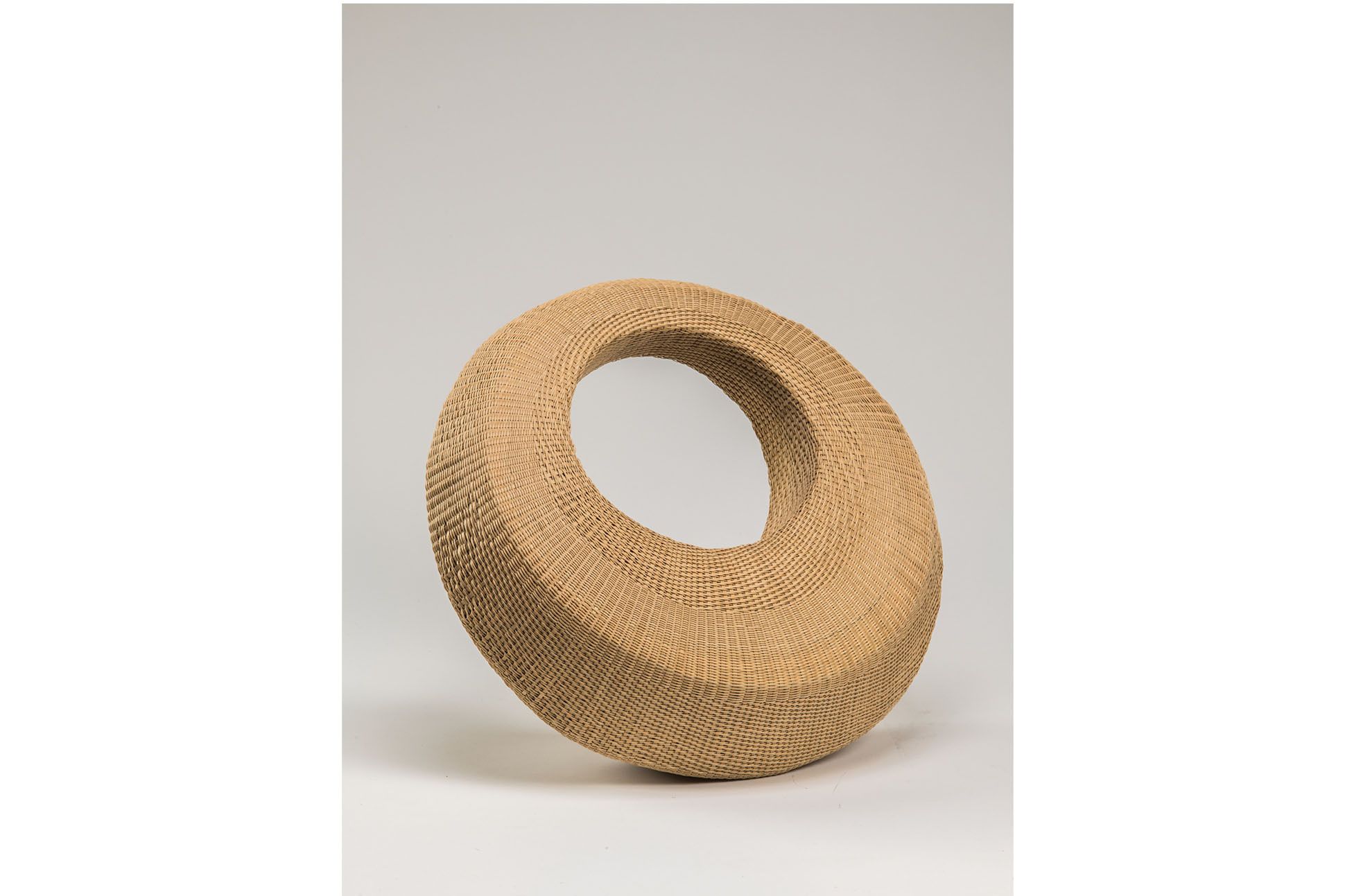 Installation art piece--wove round basket, beige.