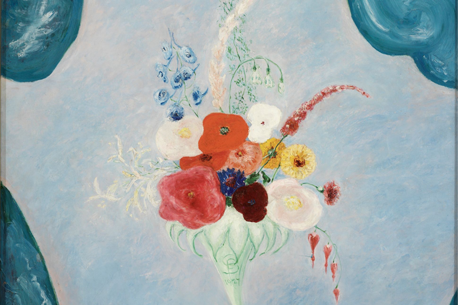 A bouquet of mixed flowers against a blue backdrop.