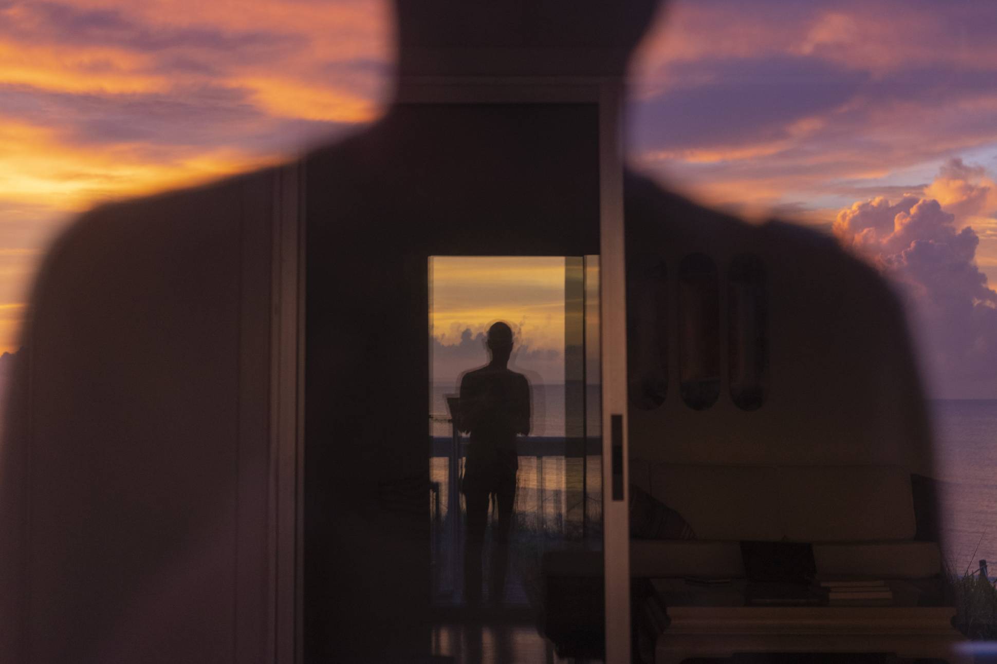 Silhouette of a man in a doorway